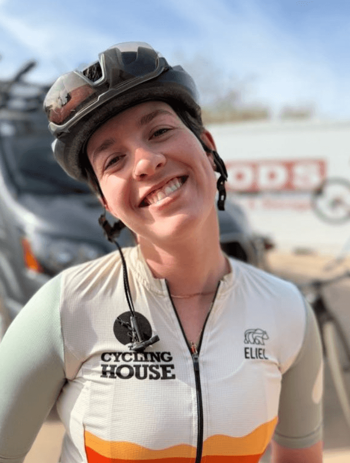 Portrait of a smiling cyclist wearing the finished Cycling House jersey