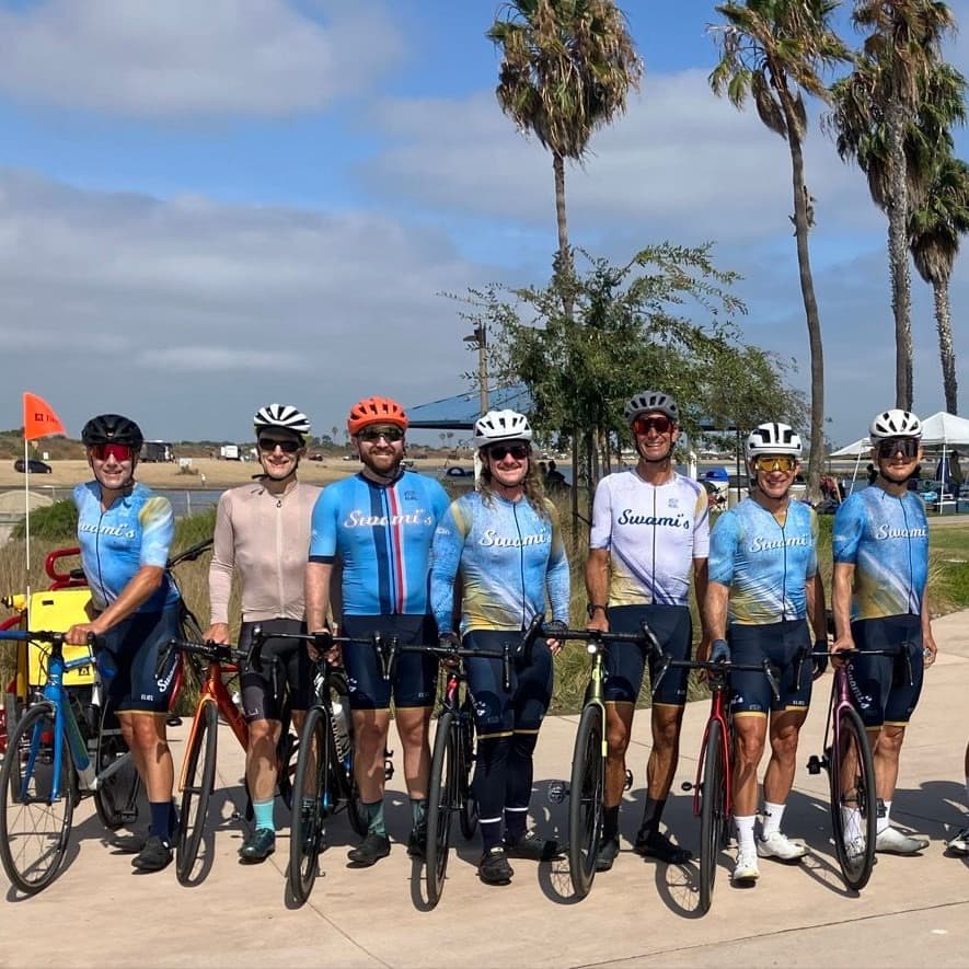 Swami’s cycling group wearing main and summer kits